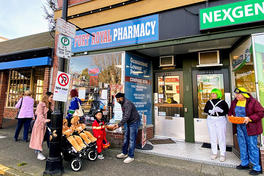 Fort Royal Pharmacist, Vik Bawa handing out candy to trick or treaters